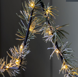 LED Pine Star - With a string of LEDs and faux pine needles woven around a wirework star this charming decoration is a perfect festive addition.