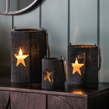 Bamboo lantern in all black with a handle and a star cut out which illuminates when you place a candle inside - available in small medium or large