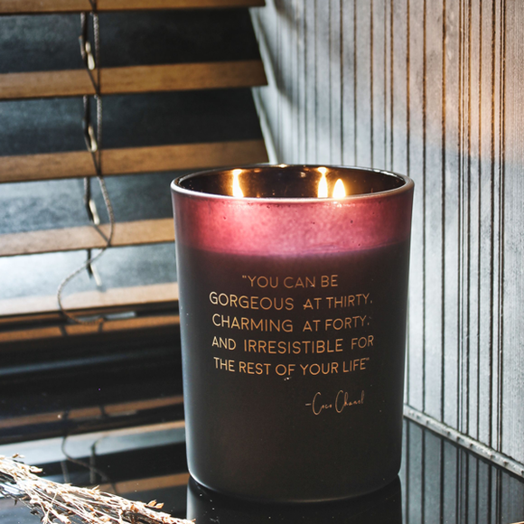 Soy Candle 12.5cm 
Presented in a Black Glass Jar with the Fragrance Warm Cashmere
Quote by Inspirators collection - Coco Chanel;
'You can be gorgeous at thirty, charming at forty, and irresistible for the rest of your life' 