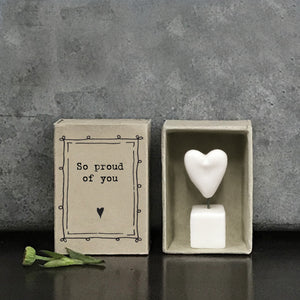 East of India quotable matchbox collection Small porcelain Heart on a wire stood on a block presented in a small matchbox with the words; 'So proud of you'