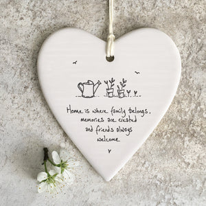 East of India Hanging Porcelain Heart with a meaningful quotes; 'Home is where family belongs, memories are created and friends always welcome' 6208