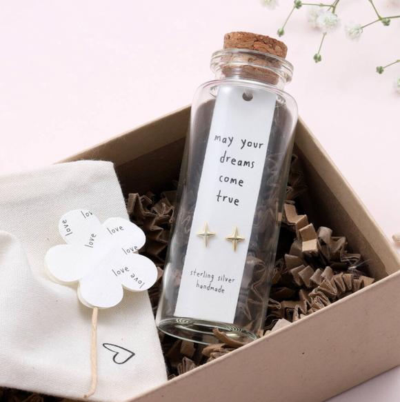 Sweet twinkle shaped earrings presented in a message bottle on a lovely card that reads 
