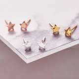 Sweet star shaped stud earrings presented in a message bottle on a card that reads "You're a star"  Sterling silver 