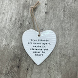 White ceramic hanging heart 10cm with a friendship quote; 'True friends are never apart, maybe in distance but never in heart'
