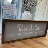 The Giggle Gift Co - Made in the UK Thick Wooden Framed Plaque L63.5cm & Grey Vinyl; This Is Us. Our Life, Our Story, Our Home.