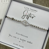 Life Charm Bracelet with entwined heart charms - reads "Sister #justbecause you are a super sister x"