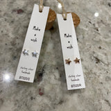 Sweet star stud earrings presented in a message bottle on a card that reads "make a wish"  Sterling silver