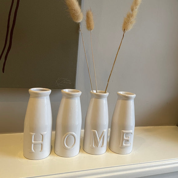 Small ceramic set of four bottles with 'HOME' inscribed 13cm 