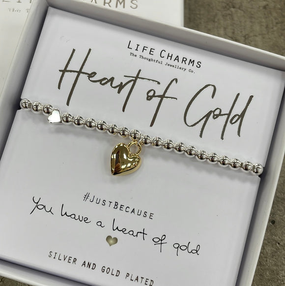 Life Charms Silver Bracelet with puffed gold heart charm reads 