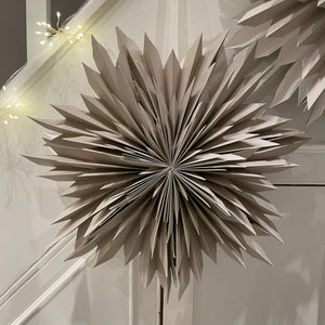 Hanging Paper Spikey Stars in Sand
