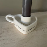Ceramic Heart shaped Candlestick Holder with loving quote: 'Sometimes love is all you need'