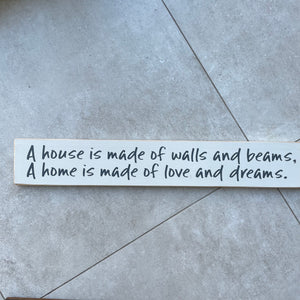 Made in the UK by The Giggle Gift co. Long L59.5cm Wooden Hanging Plaque; A house is made of walls and beams, A home is made of love and dreams.