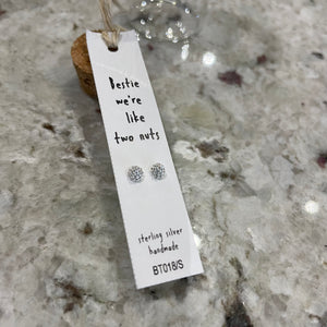 Attic Creations - giftings life's precious moments since 2010;    Message in a Bottle Sterling Silver Earrings handmade in Devon Style - Silver & Gold nut shaped stud earrings Quote on the card - 'Bestie, We're Like Two Nuts'