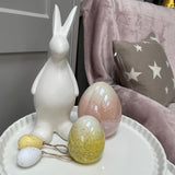 Stylish all white bunnies with a matte finish  perfect for spring