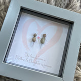 Mini Framed Pebble Art - Grey block square frame 12.5cmWith a soft background image of a pink heart and two pebble people standing inside it holding hands with a bunch of pink flowers with the quote 'The love between a Mother & Daughter is forever'