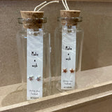Sweet star stud earrings presented in a message bottle on a card that reads "make a wish"  Sterling silver