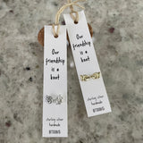 Sweet knot shaped stud earrings presented in a message bottle on a card that reads "our friendship is a knot”  Sterling Silver 