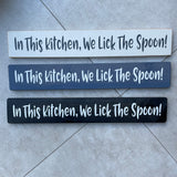 Made in the UK by The Giggle Gift co. Long L59.5cm Wooden Hanging Plaque; In This Kitchen, We lick the Spoon!