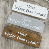 Made in the UK by Giggle Gift Co. Wooden L29.5cm Hanging Sign "I kiss better than I cook!"