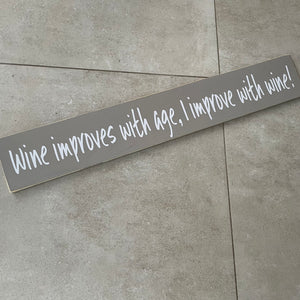 Long Wooden Hanging Plaque;  Wine improves with age, I improve with wine!   Made in the UK by The Giggle Gift co.