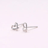 Sweet heart shaped stud earrings presented in a message bottle on a card that reads "you're loved"  Sterling Silver