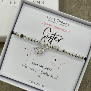 Life Charms Silver Bracelet with dangly star charm reads "happy birthday sister #justbecause it's your birthday! x"