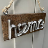 Metal 'Home' sign on Hanging Wooden plaque