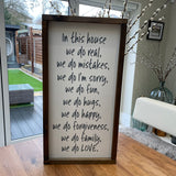 Made in the UK by Giggle Gift Co Rectangular L64cm Framed Plaque with Off White vinyl; "In this house we do real, we do mistakes, we do I'm sorry, we do fun, we do hugs, we do happy, we do forgiveness, we do family, we do LOVE."