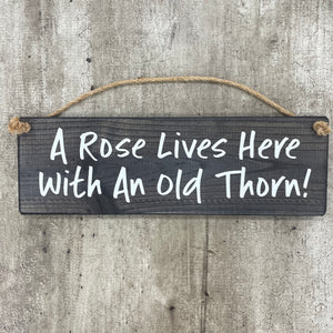 Wooden Hanging Sign - "A rose lives here with an old thorn!"
